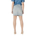Woman wearing a denim skirt and heels in the Blue Top and Denim Skirt Outfit With Heels displayed