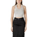 Woman wearing a peach halter top and black skirt displaying Womens Peach Halter Top and Black Skirt