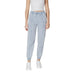Woman wearing light blue drawstring jogger pants and white sneakers