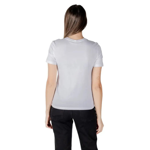 Woman wearing a light grey organic cotton short sleeve round neck T shirt