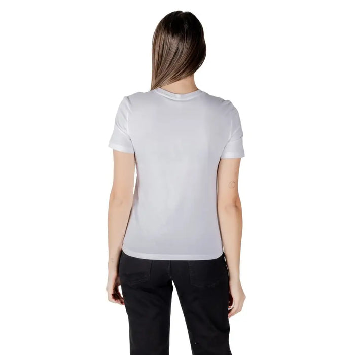 Woman wearing a light grey organic cotton short sleeve round neck T shirt