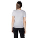 Woman wearing a light grey organic cotton short sleeve round neck T shirt