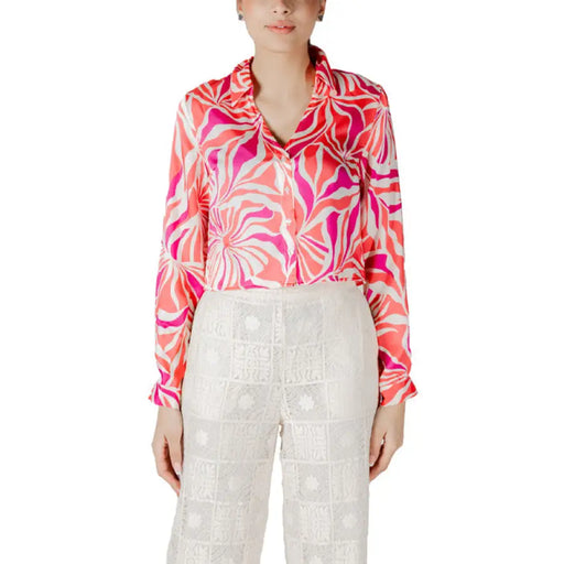Woman wearing a patterned blouse and lace pants from Patterned Blouse and Lace Pants for Women collection
