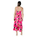 Woman wearing a Pink Floral Tiered Maxi Dress with a floral pattern and flowing design