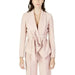 Urban chic: Woman in pink Sandro Ferrone Blazer with bow