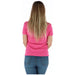 Woman wearing Pink Guess T Shirt in pink and blue jeans showcasing casual style