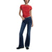 Woman wearing a red t-shirt and blue flared jeans from Women’s Flare Jeans in Blue and Dark Wash