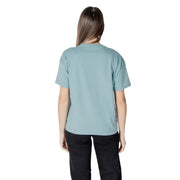 Woman in teal T shirt and black pants representing Women Light Blue T Shirt product