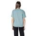 Woman in teal T shirt and black pants representing Women Light Blue T Shirt product