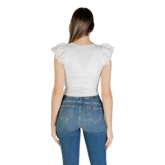 Woman wearing a white top and blue jeans displayed in White Top and Blue Jeans for Women product