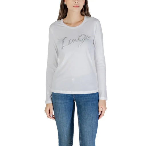 Femme portant Liu Jo T-shirt blanc à manches longues en coton avec un motif Liù Jo scintillant