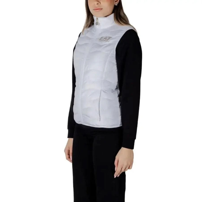 Woman showcasing the EA7 Women’s Sleeveless Turtleneck Jacket in White puffer vest
