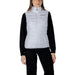 Woman in white puffer vest showcasing EA7 Women’s Sleeveless Turtleneck Jacket