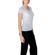 Woman wearing Armani Exchange White Sleeveless V Neck Cotton T Shirt and black pants