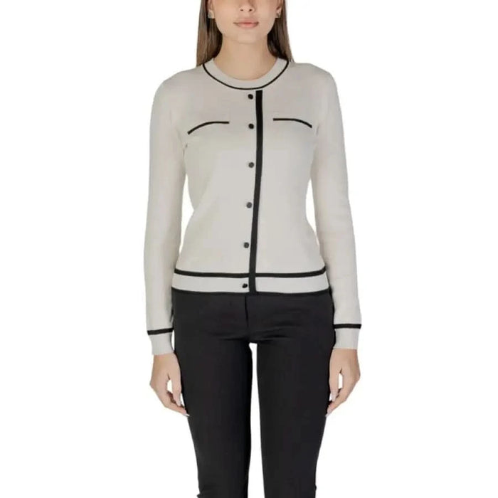 Woman’s beige cardigan with black trim featured in Morgan De Toi Women’s blue knit sweater