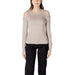 Woman in beige cold shoulder sweater with black pants from Women Cold Shoulder Sweater Collection