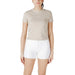 Woman wearing beige T shirt and white denim shorts from Womens Beige T Shirt and White Denim Shorts product collection