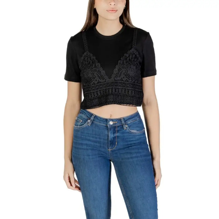 Woman wearing a black top and blue jeans from Womens White Layered Top and Blue Jeans collection