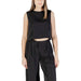 Woman wearing a black crop top and matching pants outfit from Womens Black Crop Top and Pants product line