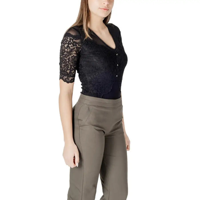 Woman wearing black lace top and olive green pants in the Womens Black Lace Top With Olive Green And Khaki Pants product image
