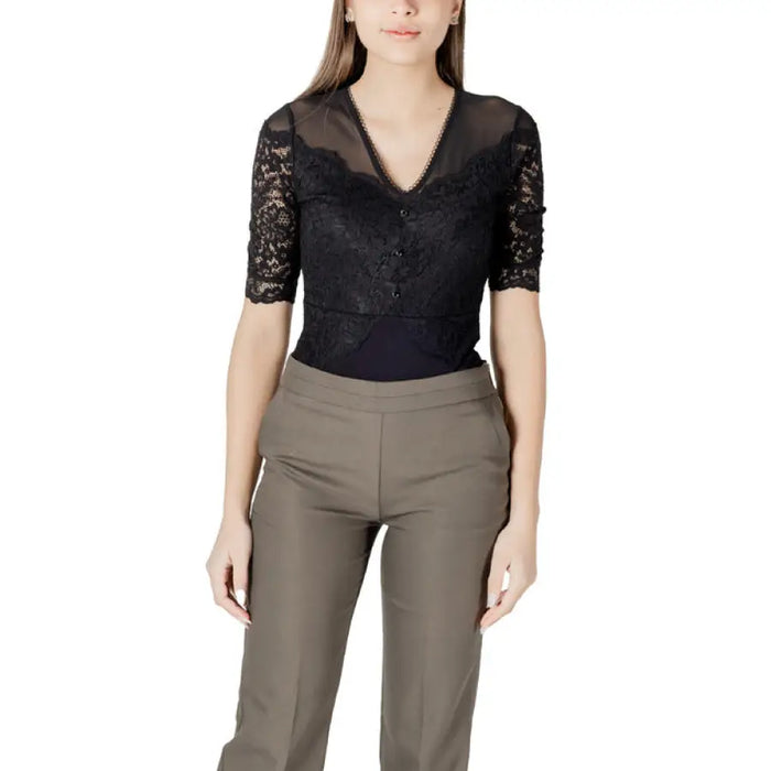 Woman wearing black lace top and khaki pants showcasing the Womens Black Lace Top With Olive Green And Khaki Pants product