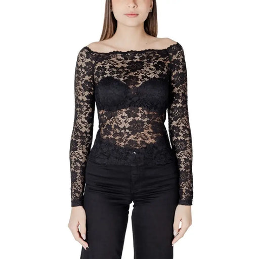 Woman wearing a black lace long-sleeve top displayed in the Women’s White Lace Long Sleeve Top product image