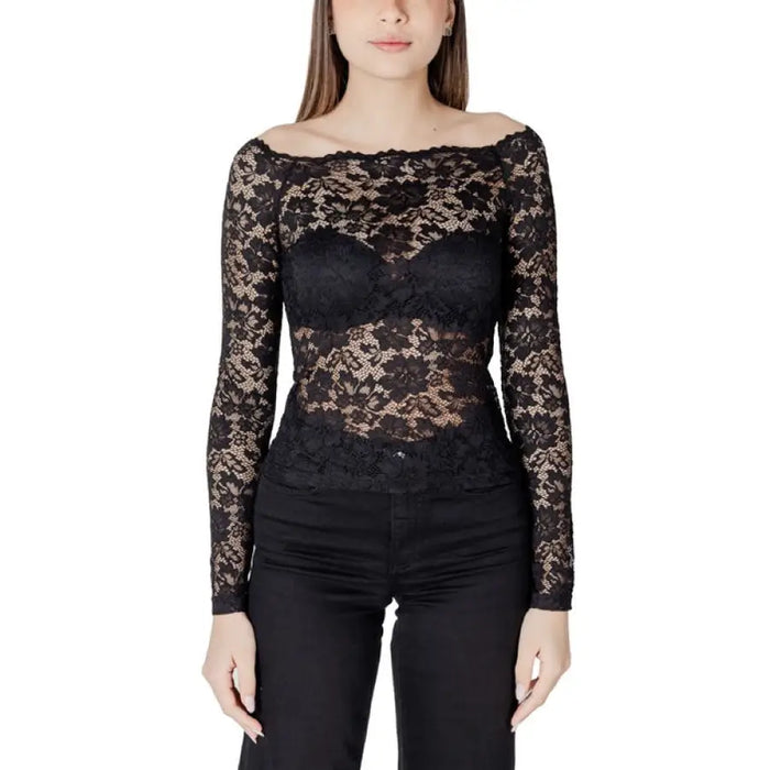 Woman wearing a black lace long-sleeve top displayed in the Women’s White Lace Long Sleeve Top product image