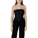 Woman wearing a black strapless top and matching black pants in the Striped Tube Top and Black Pants fashion set