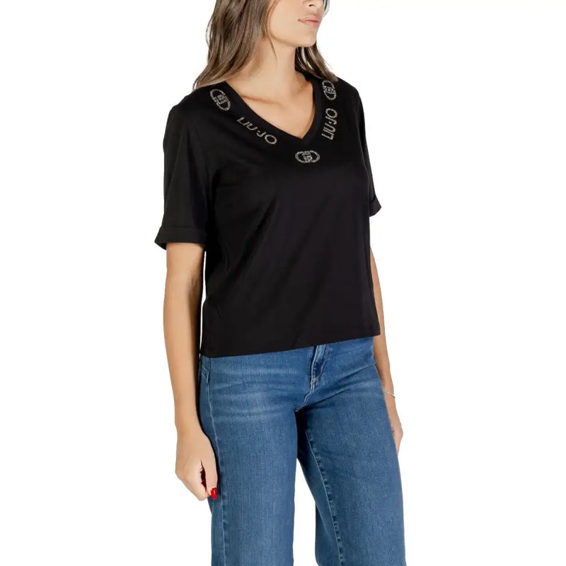 Woman wearing Liu Jo Women Black V Neck T Shirt with embroidered logo and rhinestone print