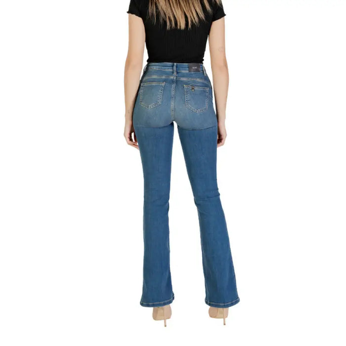Woman wearing blue denim flare jeans with bootcut style, ideal for casual wear