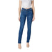 Woman wearing dark wash blue denim skinny jeans showcasing a fashionable fit