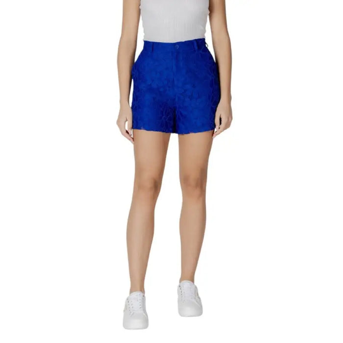 Woman wearing blue lace shorts from Women’s Black High Waisted Mini Skirt collection
