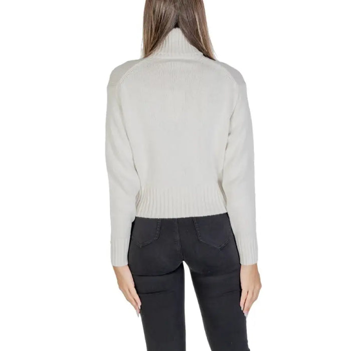 Woman wearing a light gray turtleneck sweater from the Women Light Gray Turtleneck Sweater collection