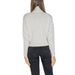 Woman wearing a light gray turtleneck sweater from the Women Light Gray Turtleneck Sweater collection