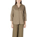 Woman wearing khaki-colored shirt and pants set from Orange Shirt and Pants Set collection
