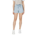 Woman wearing light blue denim paperbag shorts in a fashion product showcase