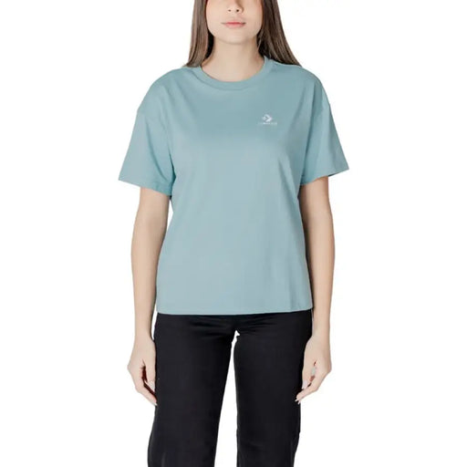 Woman wearing a light blue T shirt from the Women Light Blue T Shirt collection