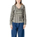 Woman wearing a long-sleeved patterned blouse from the Women’s Patterned Long Sleeve Blouse collection