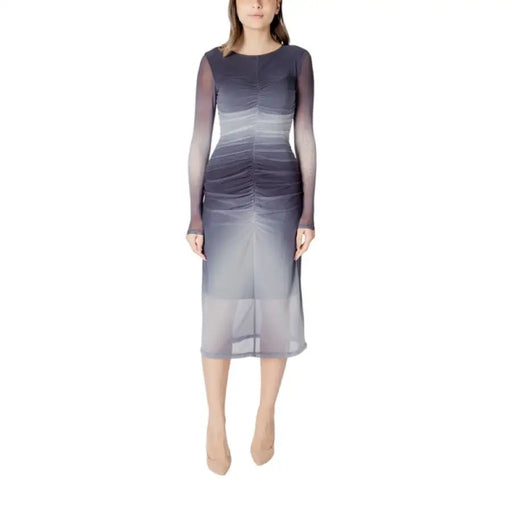 Woman wearing an Ombre Long Sleeved Mesh Midi Dress showcasing a stylish gradient design
