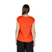 Orange V neck top for women styled with black pants