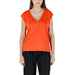 Woman wearing an orange V-neck top displayed in the Orange V Neck Top for Women product image