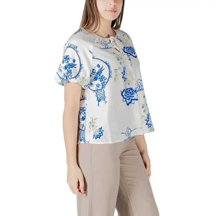 Woman wearing a patterned blouse and matching pants from Womens Patterned Blouse and Pants collection