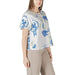 Woman wearing a patterned blouse and matching pants from Womens Patterned Blouse and Pants collection