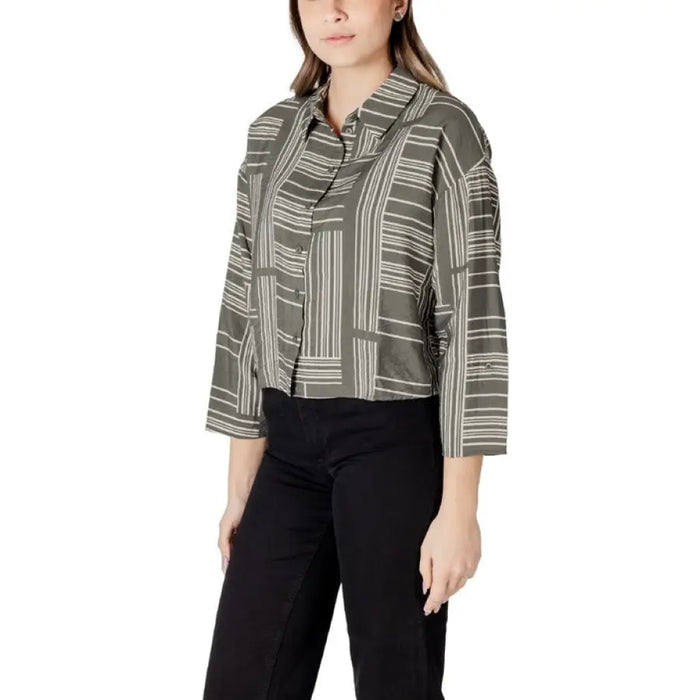 Womans patterned button-down shirt displayed in the product listing