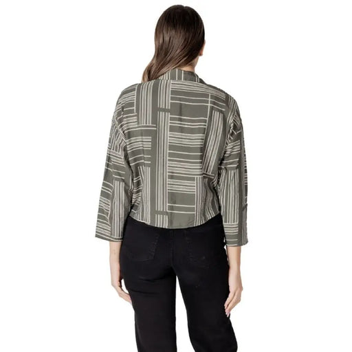 Woman wearing a patterned cropped blouse from Women’s Patterned Button Down Shirt collection