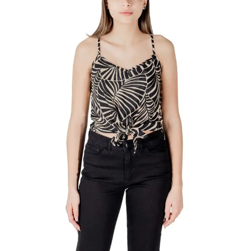 Woman wearing a patterned tie-front tank top, part of the Womens Patterned Tie Front Tank Top collection
