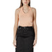 Woman wearing a peach halter top and black skirt displayed in Womens Peach Halter Top and Black Skirt product image