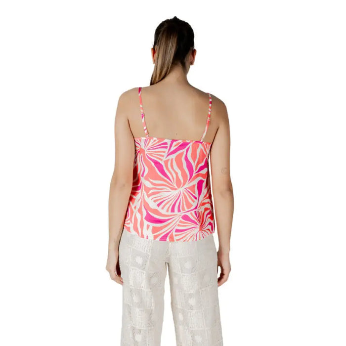 Woman’s pink and white patterned tank top from Floral Print Camisole and White Pants collection