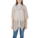 Woman wearing a sheer beige cardigan from the Women’s Beige Cardigans and Poncho Collection