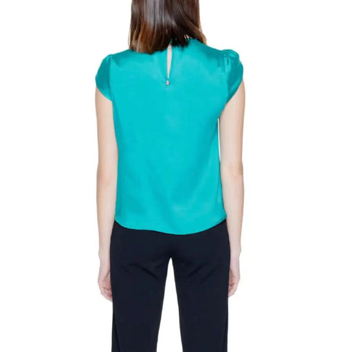 Teal blouse and black pants from Green Rinascimento Women’s Blouse collection
